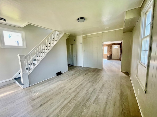 unfurnished living room featuring light hardwood / wood-style flooring