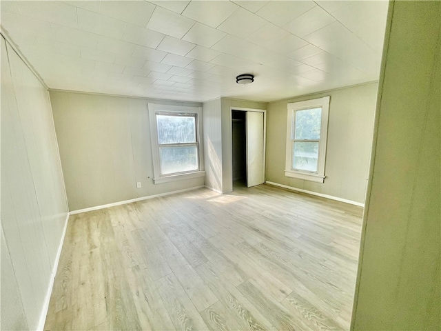 spare room featuring light hardwood / wood-style floors