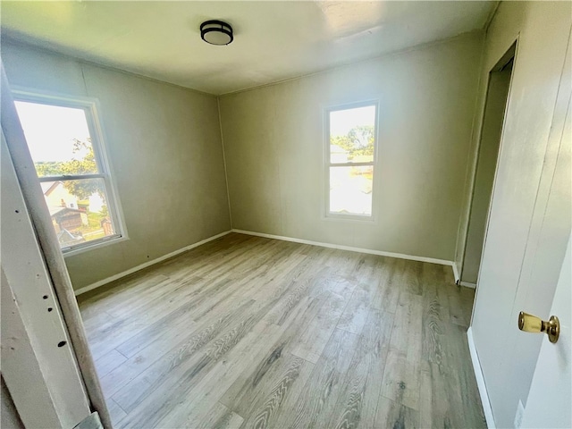 unfurnished room featuring light wood-type flooring