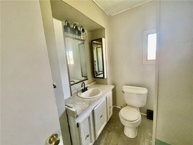 bathroom with vanity and toilet