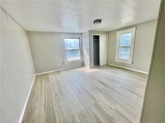 unfurnished room featuring light hardwood / wood-style floors