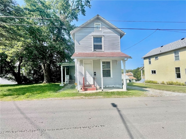 front of property featuring a front lawn and a porch