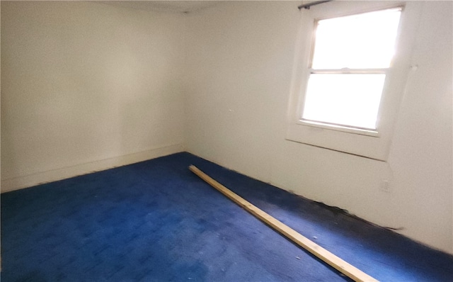 empty room with dark carpet