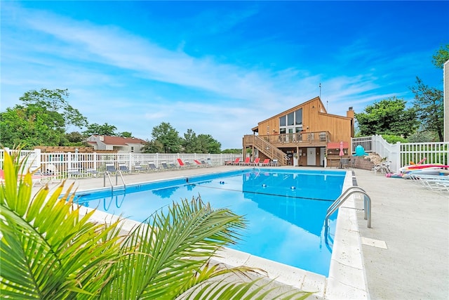 view of swimming pool featuring a deck