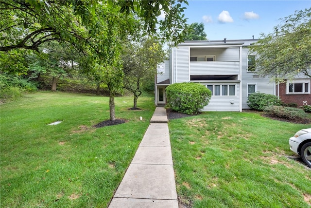 view of front of property with a front lawn