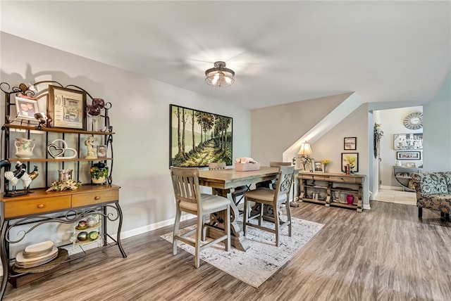 dining space featuring hardwood / wood-style flooring