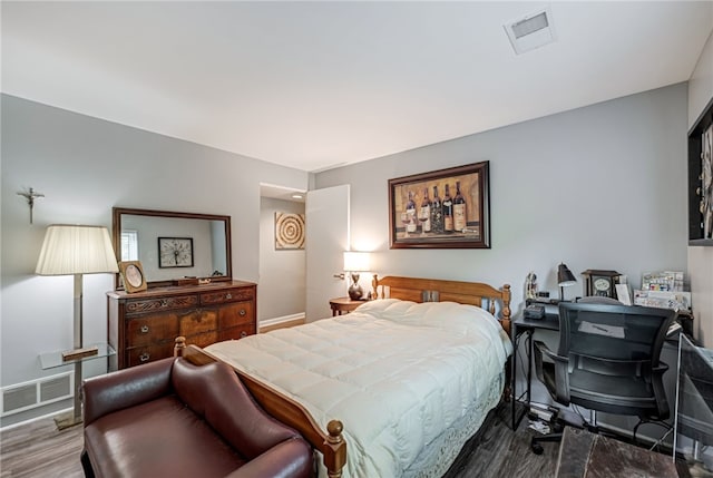 bedroom with hardwood / wood-style flooring