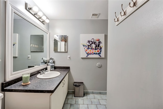 bathroom with vanity and tile patterned floors