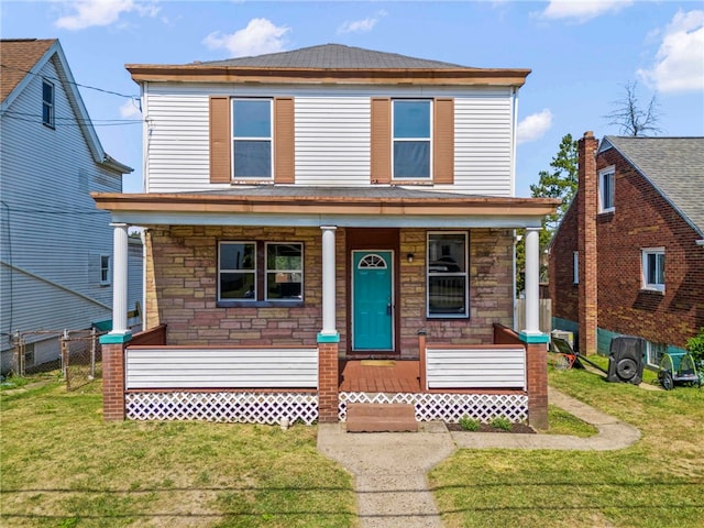 front facade with a front yard and a porch