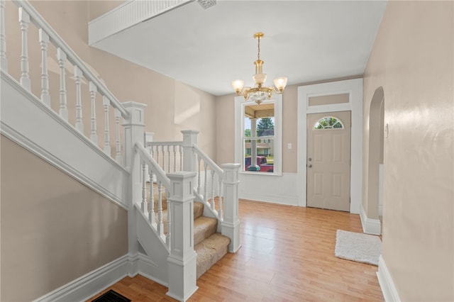 entrance foyer featuring a chandelier and light hardwood / wood-style floors