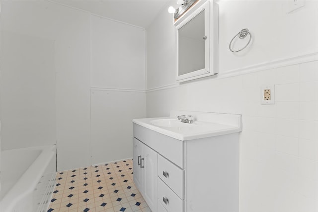 bathroom with vanity and a bathing tub