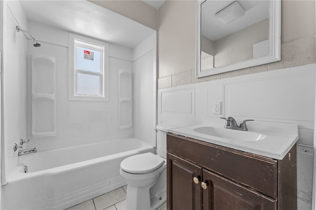 full bathroom with shower / tub combination, vanity, toilet, and tile patterned floors