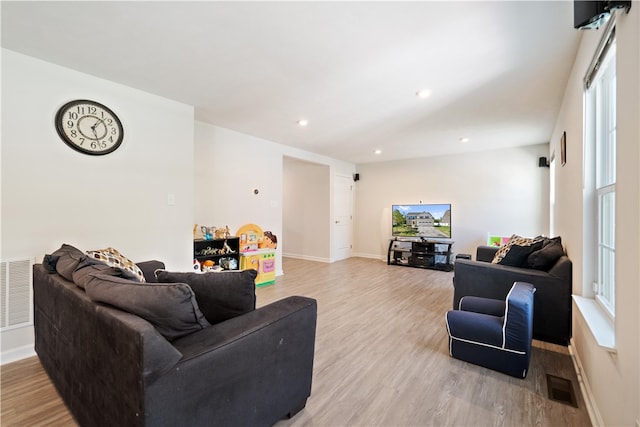 living room with light hardwood / wood-style floors