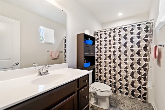 full bathroom with shower / tub combo, vanity, and toilet