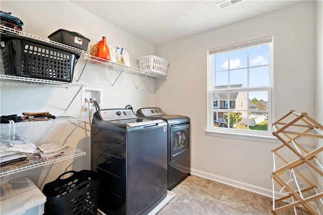 washroom featuring washing machine and dryer