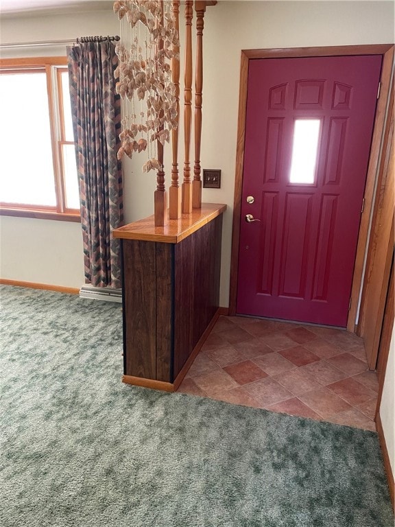 view of carpeted foyer entrance