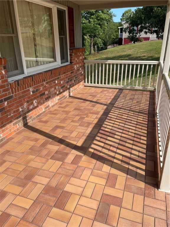 wooden deck featuring a yard