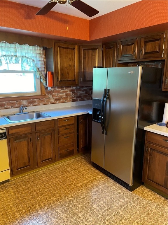 kitchen with ceiling fan, sink, tasteful backsplash, stainless steel refrigerator with ice dispenser, and dishwasher