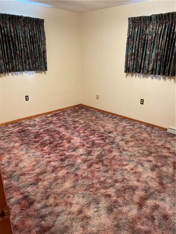 unfurnished room featuring carpet floors