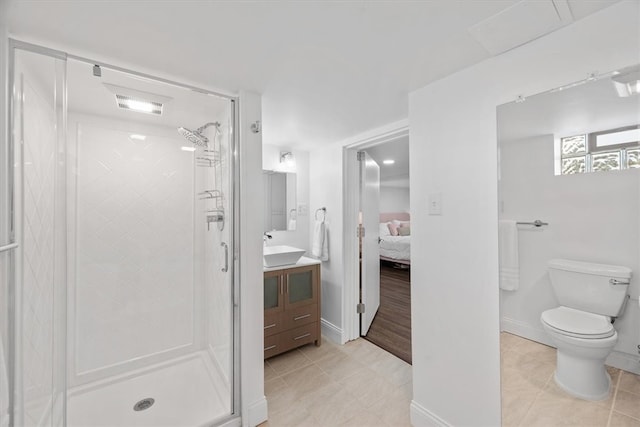 bathroom with walk in shower, vanity, toilet, and tile patterned flooring