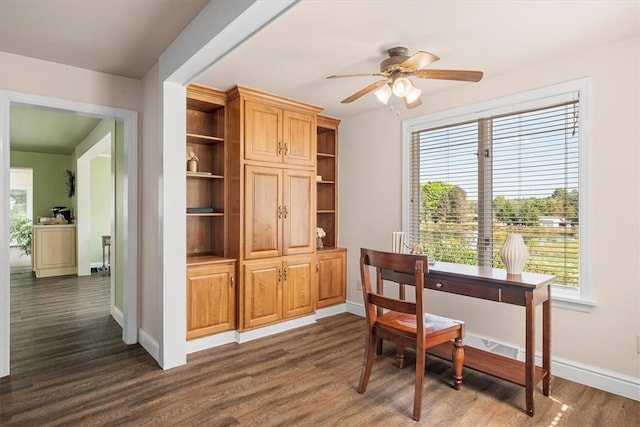 office featuring dark wood-type flooring and ceiling fan