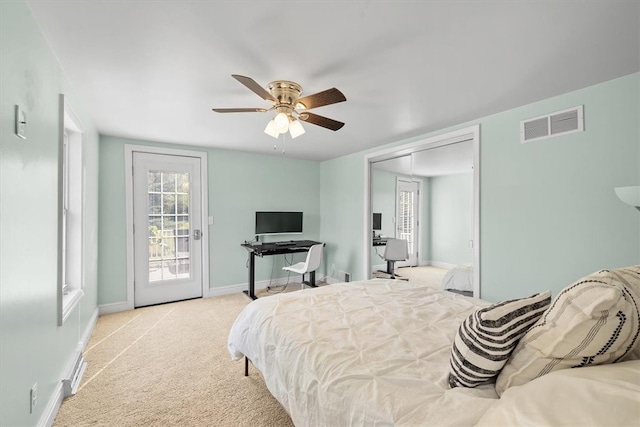 carpeted bedroom with ceiling fan and access to outside