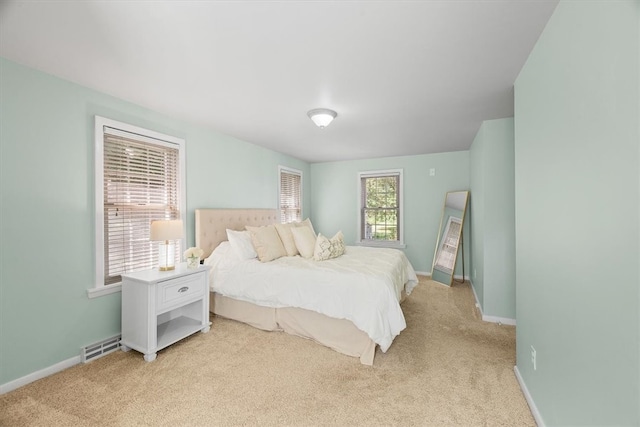 bedroom with light carpet