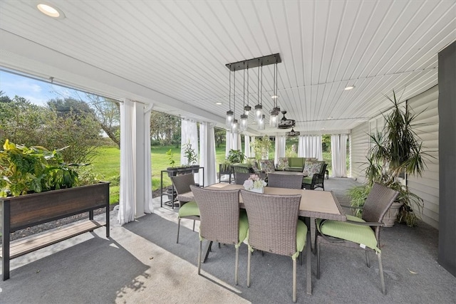 sunroom / solarium featuring wooden ceiling