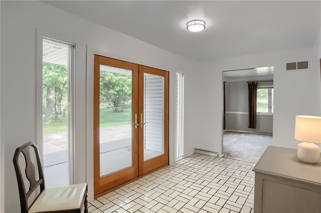 entryway with light colored carpet and french doors