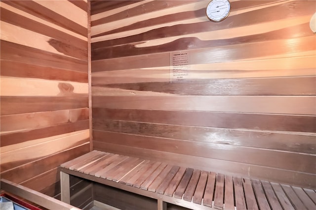 view of sauna / steam room featuring wooden walls