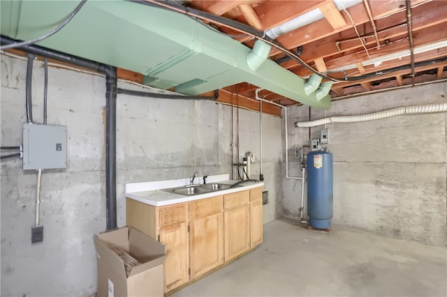 basement featuring gas water heater and sink