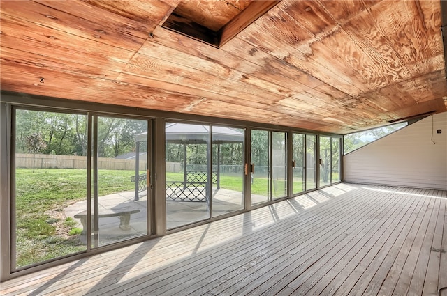 unfurnished sunroom featuring wood ceiling