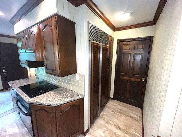 kitchen featuring dark brown cabinetry, light stone counters, decorative backsplash, and black appliances