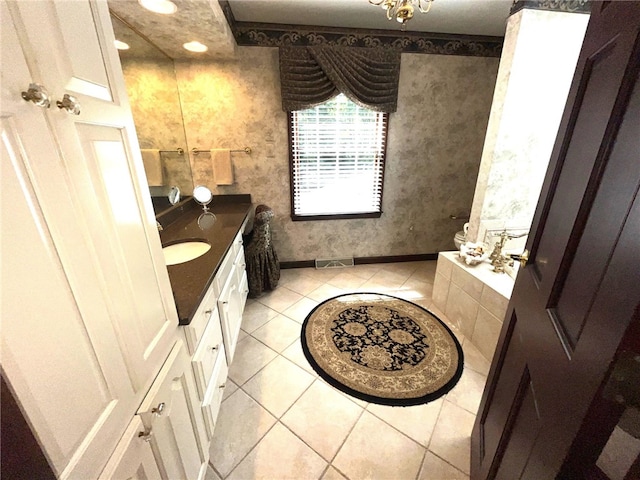 bathroom featuring tile patterned flooring and vanity