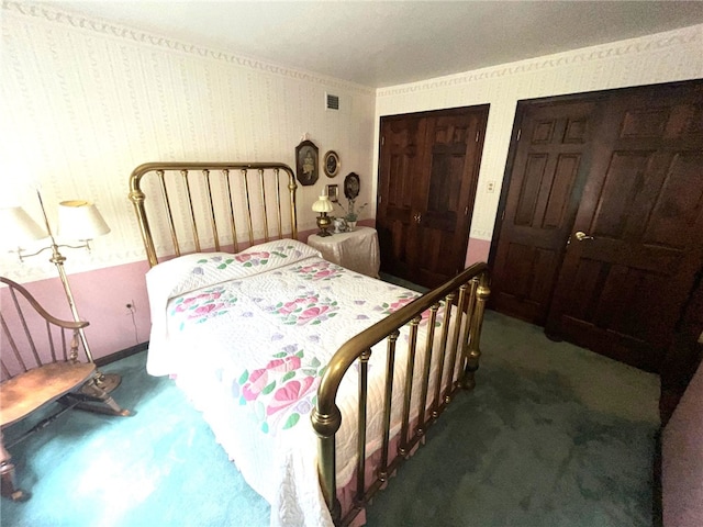 bedroom with dark colored carpet