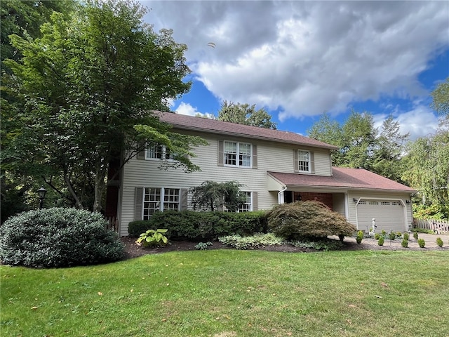 view of front of home featuring a garage and a front lawn