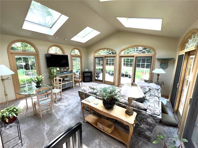 living room featuring carpet floors and lofted ceiling with skylight