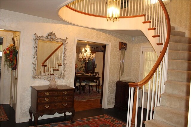 interior space with a chandelier and hardwood / wood-style flooring