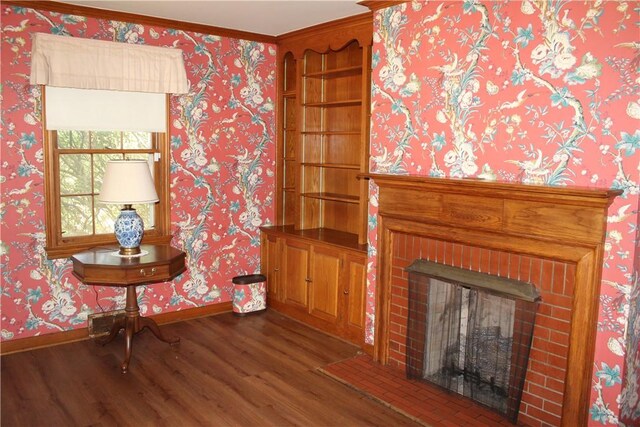 interior space featuring hardwood / wood-style flooring, a fireplace, and ornamental molding