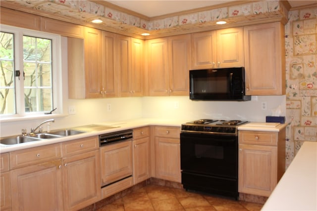 kitchen with sink, black appliances, light tile patterned floors, crown molding, and light brown cabinetry