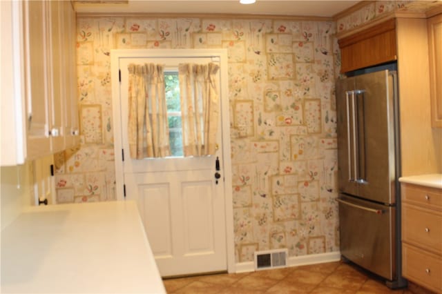 entryway with light tile patterned floors