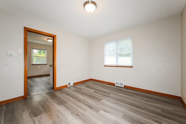 spare room with hardwood / wood-style flooring