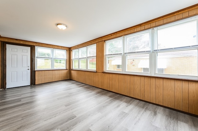 unfurnished sunroom with plenty of natural light