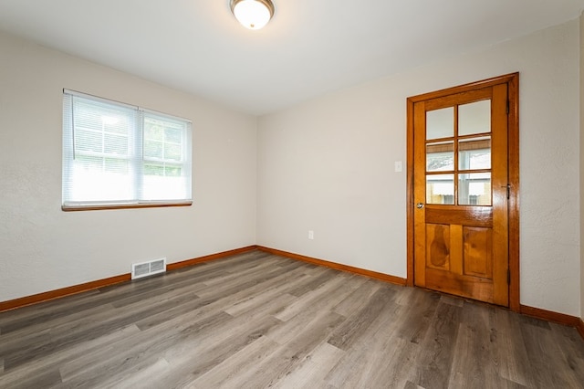 spare room featuring hardwood / wood-style floors