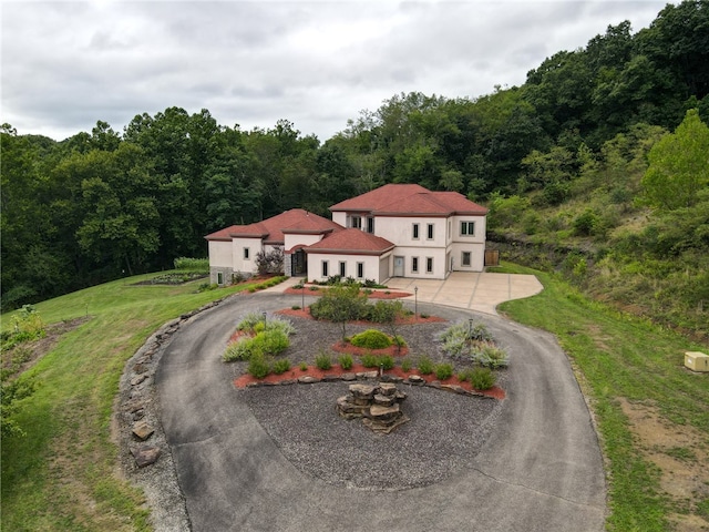 view of front of home with a front yard and a garage