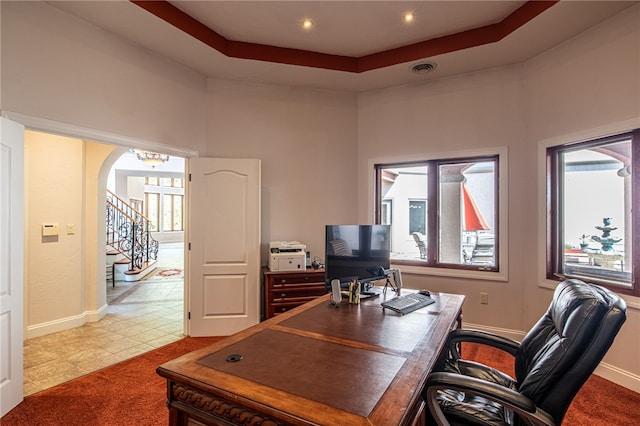 office with a raised ceiling