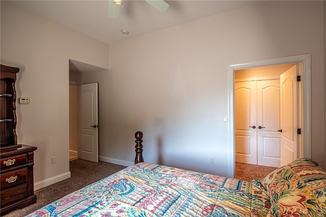 carpeted bedroom with ceiling fan and a closet