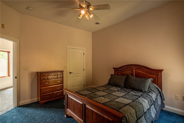 bedroom with dark colored carpet and ceiling fan