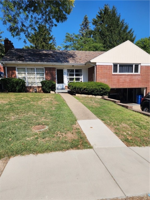 ranch-style home with a front lawn