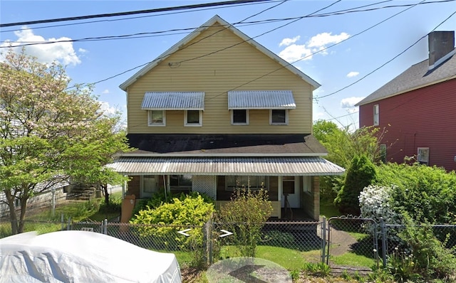 rear view of house with covered porch